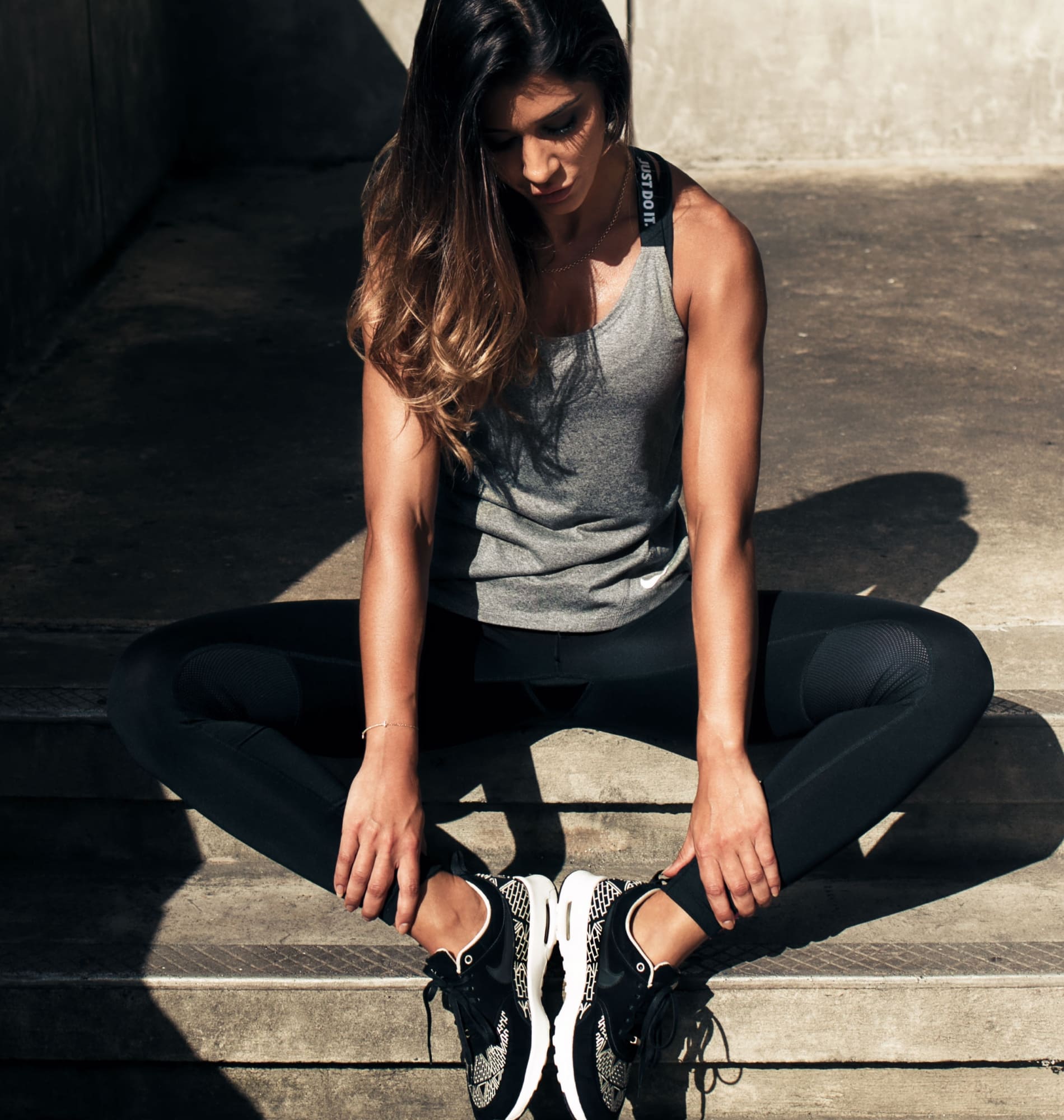 Woman sitting looking at feet service16@2x